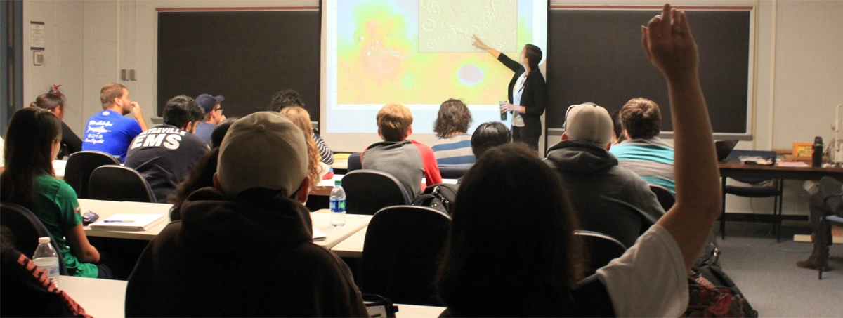 Classroom with Professor explaining diagram